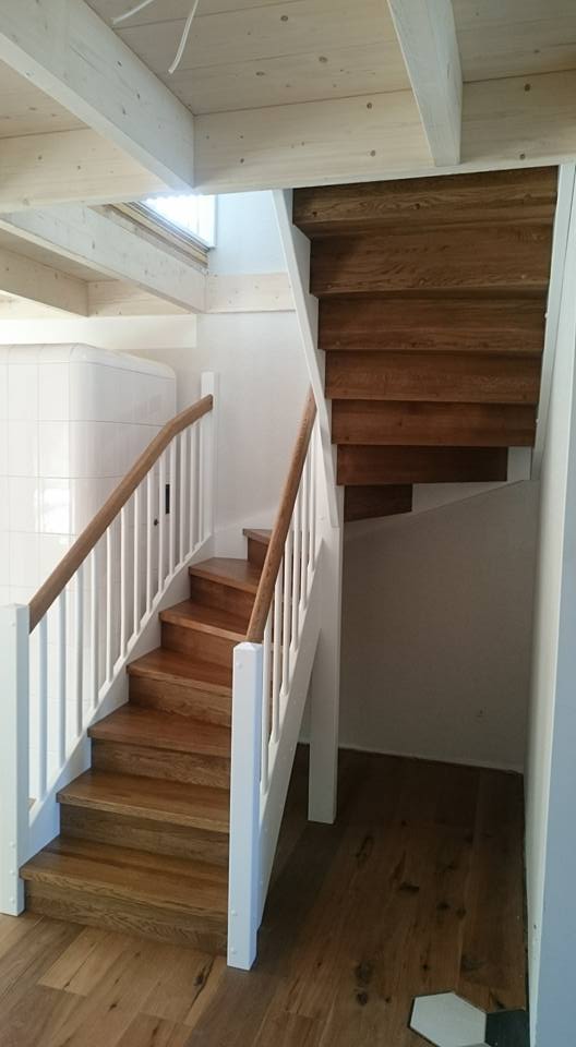 Solid wood staircase with oak treads and white balusters